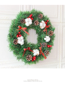 Detailed Christmas wreath featuring red berries, pine cones, and a plaid bow decoration