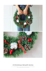 Detail of Christmas wreath with pine cones, cotton bolls and red plaid bow decoration