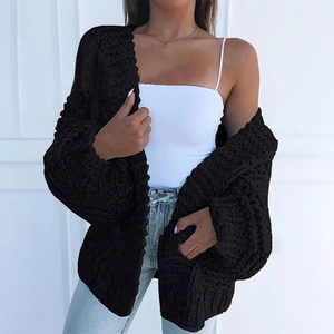 Detail view of thick black chunky knit mohair cardigan with soft textured finish