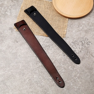 Detail of black and dark brown vintage leather wristbands with silver metal buckles