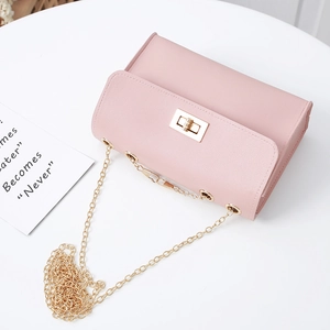 Pink PU mini shoulder bag featuring a gold chain strap and elegant twist lock closure
