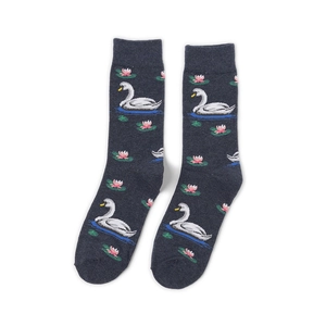Detail view of cotton mid-calf socks with white swan and pink water lily jacquard pattern