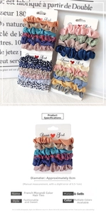 Detail of Morandi silk satin scrunchies set on display card showing 8cm diameter size