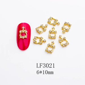 Detailed view of 6x10mm gold alloy heart crown nail art charm with white rhinestones