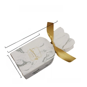 Macro detail of red striped festive candy box with golden ribbon and Specially For You text