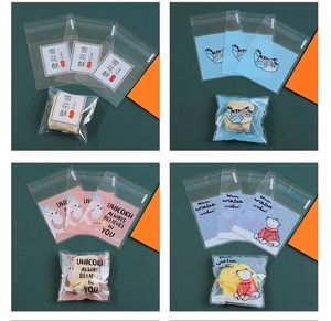 Detail view of 4 self-adhesive treat bags for nougat and cookies with cute animal prints