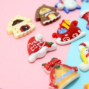 Assorted Christmas resin charms featuring Santa hats and snowmen for DIY crafts