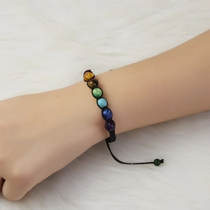 Adjustable seven chakra beaded bracelet with multi-color natural stones on black woven cord