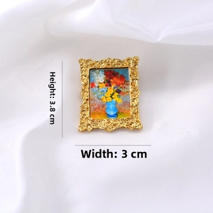 Baroque style gold frame brooch with miniature floral oil painting and detailed embossing