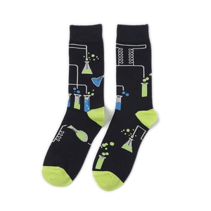 Detail of crew socks featuring green science lab patterns like flasks and test tubes