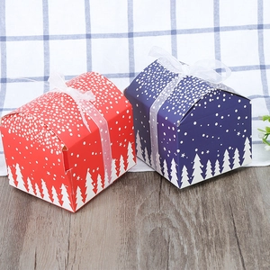Christmas gift boxes in red and blue with snowflake patterns and white chiffon ribbons