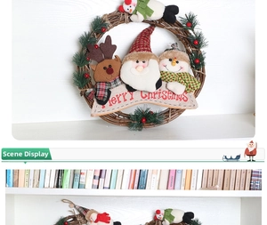 Detail of Christmas wreath with Santa, snowman and reindeer plush on rattan ring