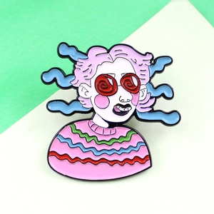 Macro detail of enamel brooch showing eccentric girl with red swirl glasses and pink wavy hair