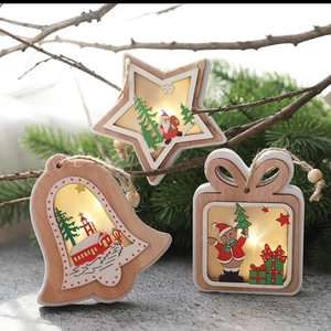 Wooden LED Christmas star ornaments with warm lights on pine branches and wood