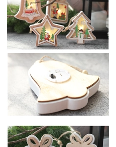Detail of wooden Christmas star with LED lights, showing battery compartment and hemp rope