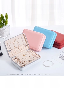 Portable PU leather jewelry box detail showing earring board and necklace storage hooks