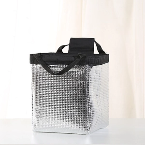 Detail of insulated silver foil lining and square texture on portable lunch bag