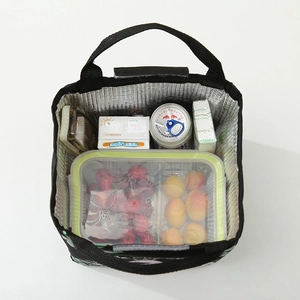 Internal view of black insulated lunch bag with silver foil lining and velcro closure