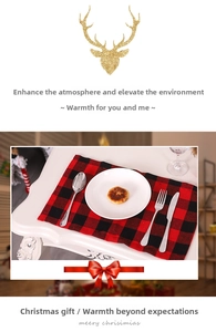 Detail of red and black buffalo plaid placemat set with cutlery for Christmas table decor
