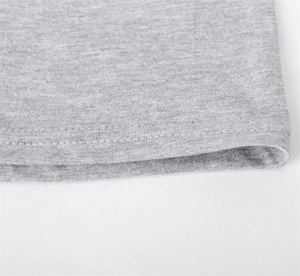Detailed close-up of double-needle hem stitching on heather grey knit sportswear