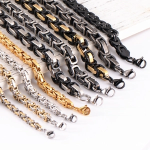 Detail view of round snake bone chains in gold, silver, and black stainless steel options