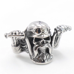 Macro shot of a vintage silver motorcycle skull ring with intricate biking details
