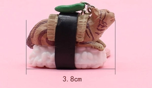 Close-up of a 3.8cm cute cartoon sushi cat keychain with brown tabby resin detailing