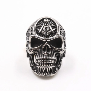 Vintage stainless steel skull ring featuring a masonic G symbol and a punk finish