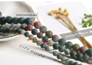 Macro shot of matte Indian Agate beads showing natural earthy tones and textures