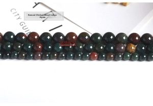 Macro shot of natural Indian agate round beads for DIY jewelry with multi-color patterns