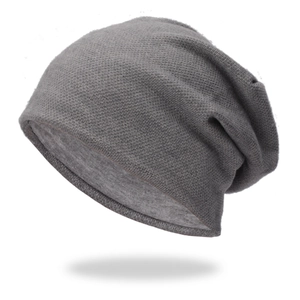 Close-up of thick dark grey knitted beanie with ribbed texture and double layer warmth