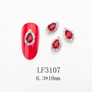 Detailed view of 6.3x10mm teardrop red ruby nail art charms with AB crystal halo