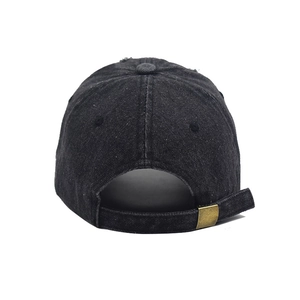 Detailed back view of distressed black denim baseball cap with adjustable brass buckle