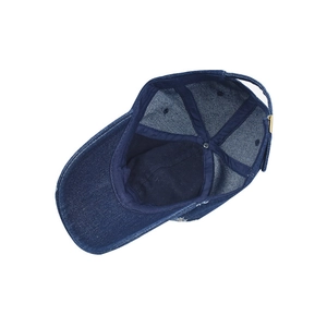 Internal view of distressed denim baseball cap with reinforced stitching and metal buckle