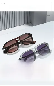 Detail of vintage square sunglasses with tortoise and gray frames and metal accents