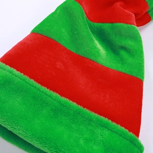 Macro shot of striped red and green plush fabric on a Christmas elf hat detail