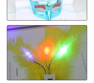 Detail of LED light fiber feathers and battery pack for glowing Halloween party mask