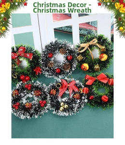 Close-up of assorted Christmas wreaths with pine cones, red bows, and festive ornaments