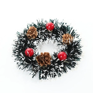 Christmas wreath with dark green needles, pine cones and red berries on white background
