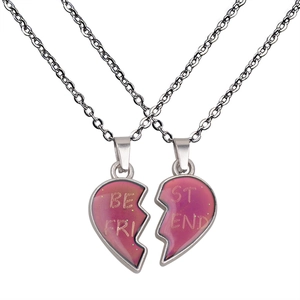 Close-up of split heart Best Friend necklaces with glittery pink-purple color change effect