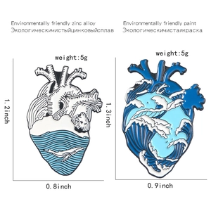 Detailed view of heart-shaped ocean wave enamel pins with precise dimensions and weight