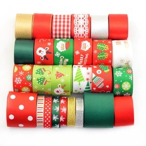 Detailed view of assorted Christmas ribbons with festive patterns and Merry Christmas prints