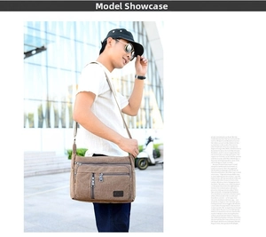 Brown canvas shoulder bag with multiple zippered pockets and adjustable wide strap