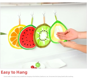 Close-up of hanging absorbent fruit-patterned hand towels with built-in loops for kitchen