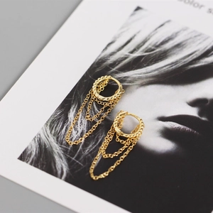 Detailed shot of golden S925 sterling silver hoop earrings with multi-layer tassel chains