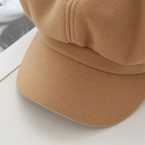 Detail showing high-quality khaki wool fabric texture and stitching of the octagonal cap