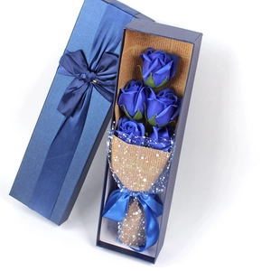 Detail of blue soap rose gift box featuring five roses and a matching blue ribbon bow