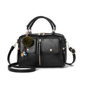 Fashionable black pebbled PU leather Boston bag with side pockets and plush charm accessory