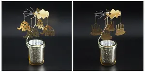 Details des goldenen drehbaren Kerzenhalters mit Elefanten- und Geburtstagskuchenanhängern