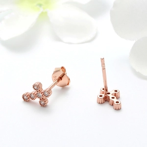 Detail of S925 sterling silver cross earring with rose gold finish and 925 hallmark